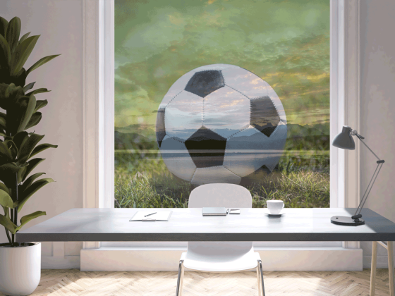 Preview: Transpartente Fotofolie Fußball im Gras