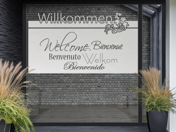 Fensterfolie mit Willkommen in verschiedenen Sprachen